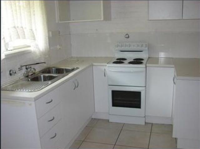 CENTRAL LOCATION THIS TIDY RESIDENTIAL FLAT WITH ITS OWN CARPORT