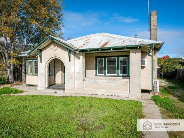 Central Location with Plenty of Potential!