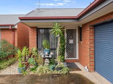Central, Low Maintenance Living at Its Best