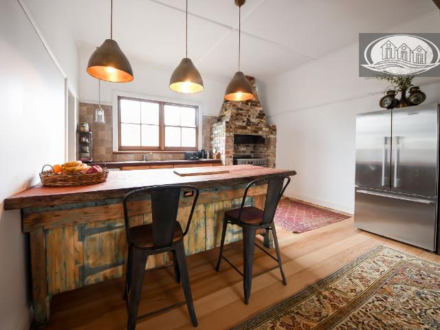 CENTRALLY LOCATED TASTEFULLY RENOVATED 4 BEDROOM HOME