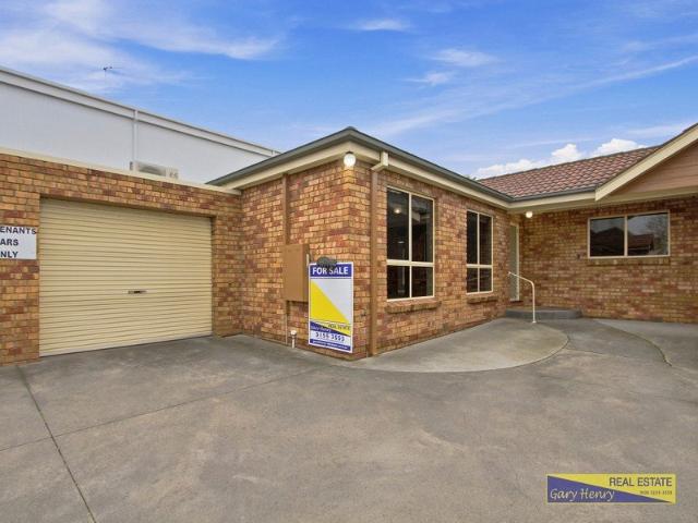 Centrally Located Two Bedroom Unit Just Steps from the Water