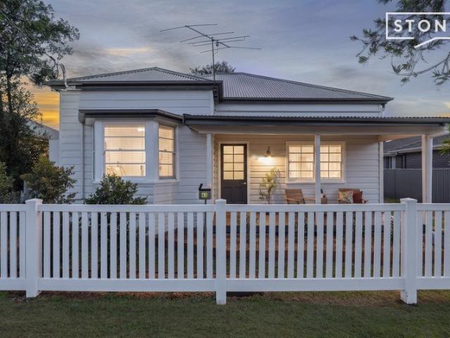 Character cottage in sought after locale, with side access to rear yard