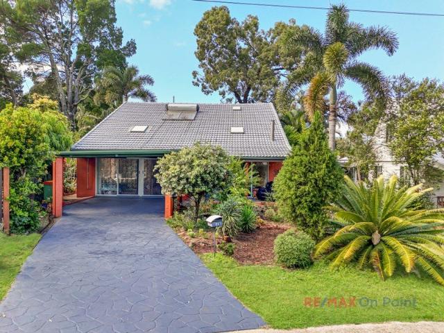 Character Filled Coastal Retreat with Cathedral Ceilings, Dual Living Potential & Lush Orchard Gardens