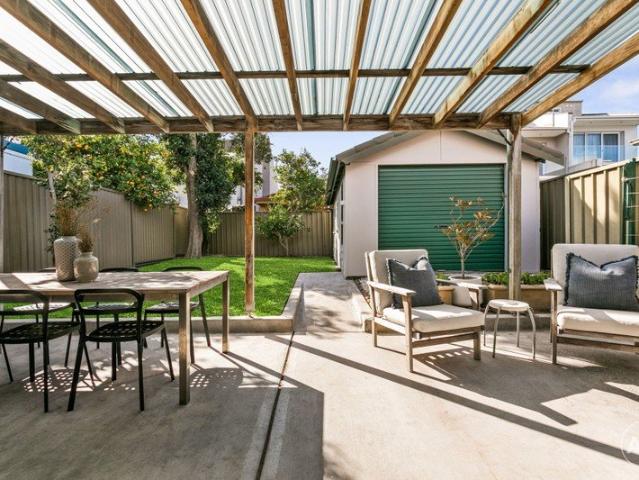 Character Filled Freestanding Home with a Sunny North Facing Backyard