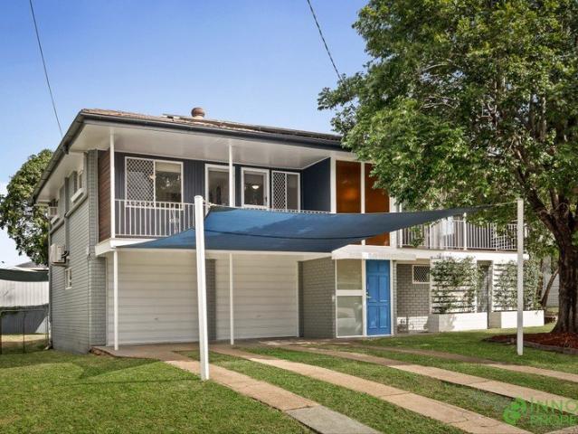 Character Filled Renovated Family Home With Multiple Living Areas & An Easy Side Access!