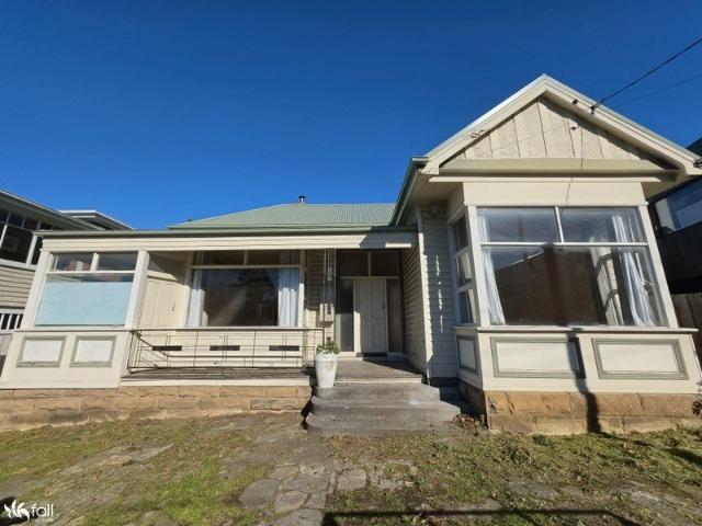 Character Filled Sandy Bay Home in a Prime Location
