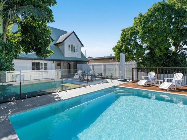 Character Home with a Resort Style Pool and Rare Family Space