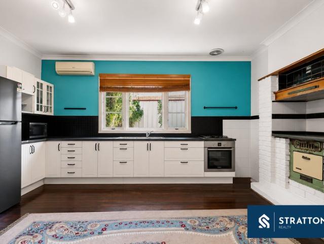 Character Home with Flexible Living Spaces & Expansive Backyard