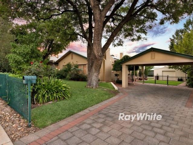 Character Home with Immaculate Gardens