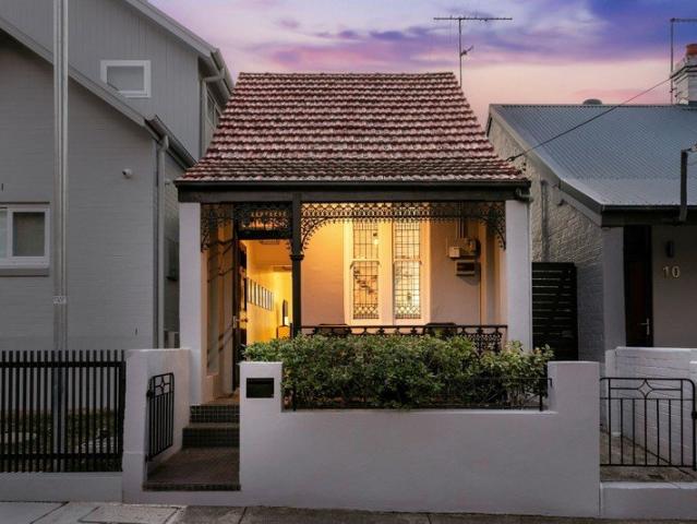 Character Home with Sunlit Courtyard and Generous Attic Space