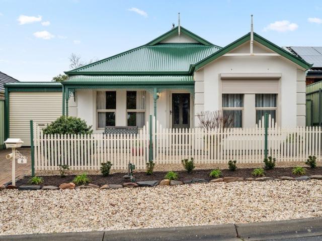 Character living in a quiet enclave, just footsteps from the reservoir's idyllic edge