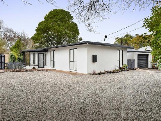 CHARACTER, LIGHT & LAYERED LIVING IN A TIGHTLY HELD EMERALD POCKET