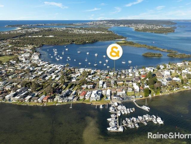 Character, Space & Lake Views with Exceptional Garaging!
