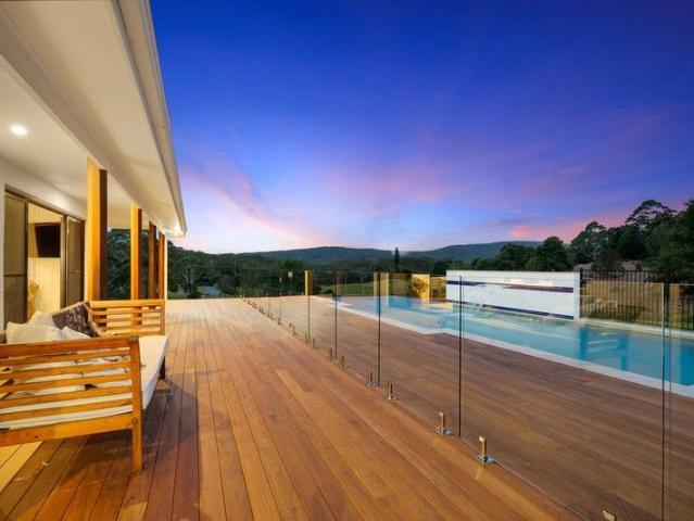 Move in ready executive residence on coastal acreage, extensively renovated inside and out, and only five minutes to the surf and lakes