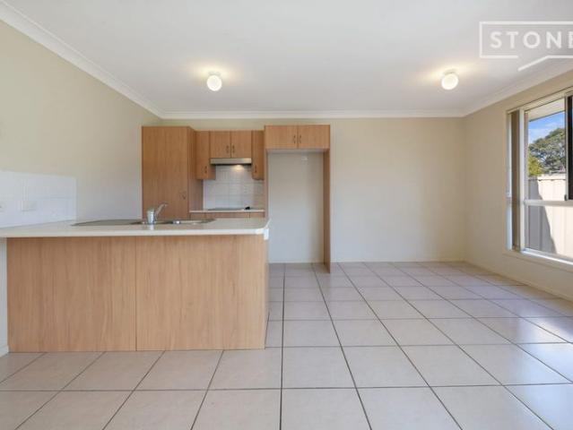 Charming 2 Bedroom Brick Duplex with Single Garage