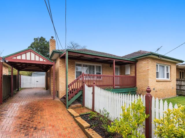 Charming 3 Bedroom Brick Home with Spacious Backyard