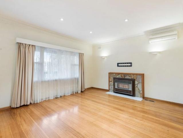 Charming 3 Bedroom Brick Home with Spacious Backyard