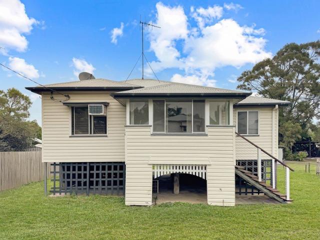 Charming 3 Bedroom Home with a Big Backyard & Spacious Entertaining Deck!