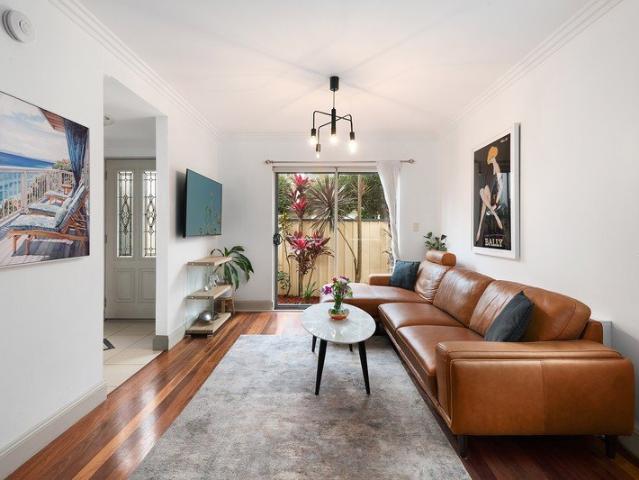 Charming Townhouse with North Facing Courtyard and Superb Location