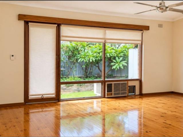 Charming Two Bedroom Unit with Hardwood Floors and Rear Garden