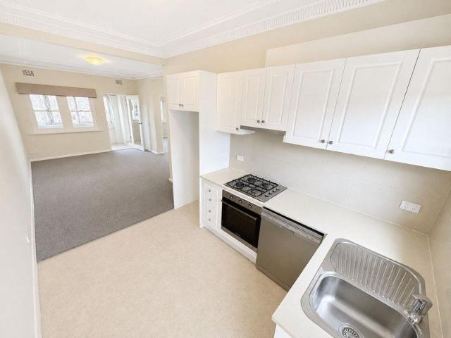 Charming Two Bedroom Apartment with Modern Kitchen + Sunroom