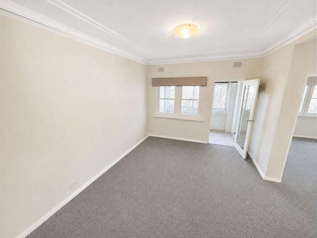 Charming Two Bedroom Apartment with Modern Kitchen + Sunroom