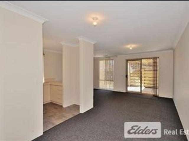 Charming Unit with Courtyard and Carport