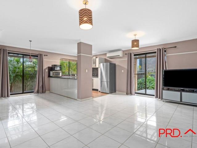 Charming brick townhouse with lush wraparound backyard on a huge 323 sqm lot