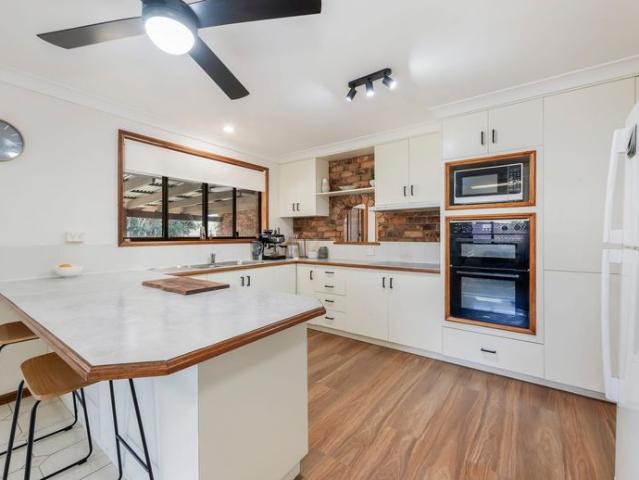 Charming Brick Home with a Pool: Perfectly Positioned for Family Living and Entertaining!