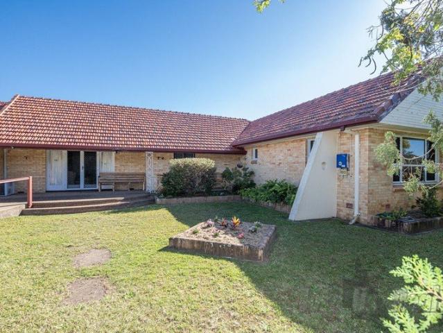 Charming Brick Home with ample rooms to create to suit your needs!