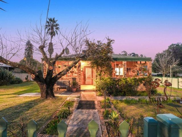 Charming Character Cottage with Established Gardens Fruit Trees and Endless Potential