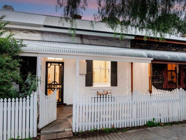 Charming Character Cottage with Rear Lane Access in Prime City Fringe Location