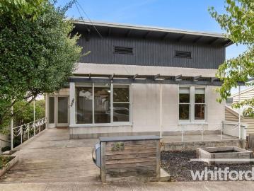 Charming character home with versatile living & rear lane access
