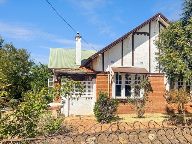 CHARMING CHARACTER HOMESTEAD WITH EXTENSIVE SHEDDING!