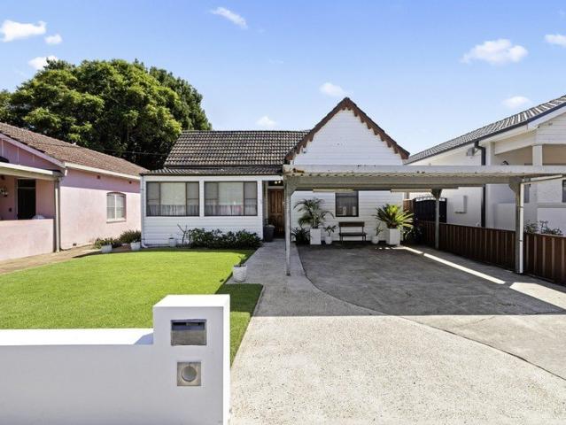 Charming Cottage with Endless Potential in Prime Location
