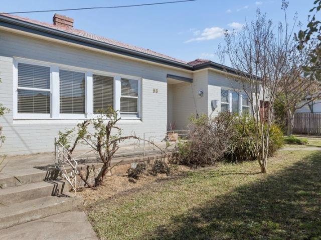 Charming Double Brick Home with a Private Backyard Oasis