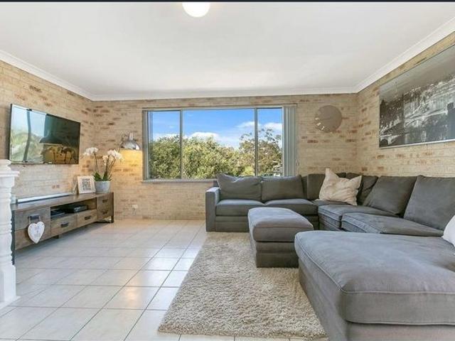 Charming Dual Level Family Home in Serene Setting