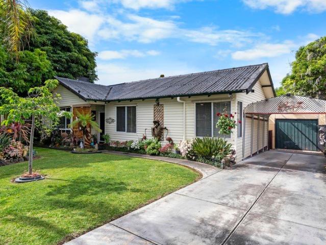 Charming Family Gem with Lush Gardens and Outdoor Living Appeal