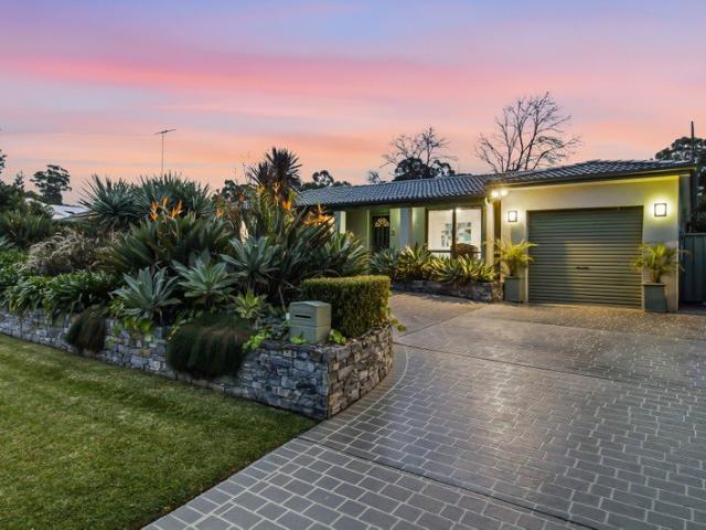 Charming Family Home with Beautiful Gardens!