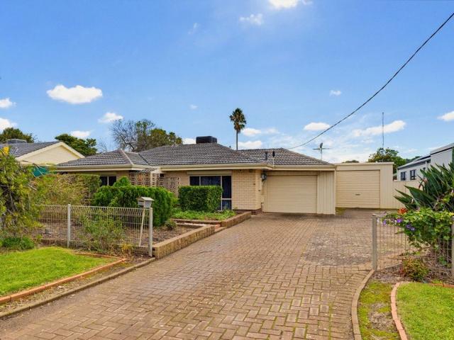 Charming Family Home with Extensive Outdoor Living and Workshop Appeal