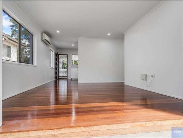 Charming Family Home with Polished Floors, Double Shed & Spacious Backyard in Central Kallangur!