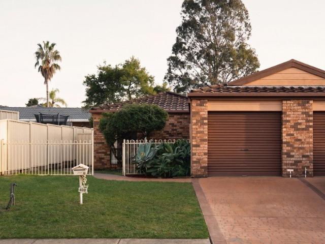 Charming Family Home with Spacious Living and Lush Backyard
