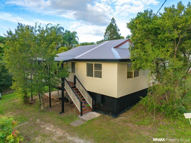 Charming Highset Home with Wrap Around Verandah in a Convenient Gympie Location