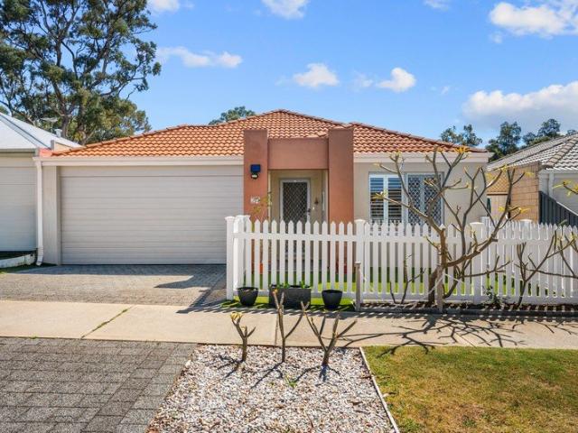 CHARMING, LOW MAINTENANCE LIVING WITH A PRIVATE OUTDOOR RETREAT