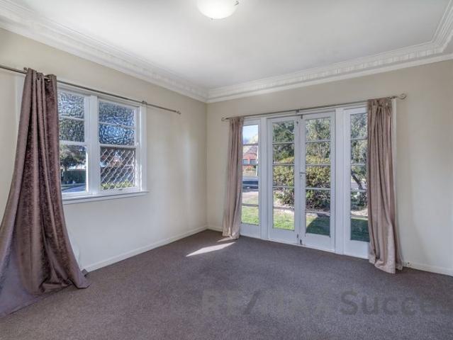 Charming Lowset Home in Convenient Newtown Location