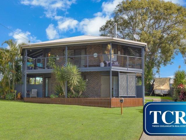 CHARMING NORTH FACING TWO LEVEL HOME WITH OCEAN VIEWS