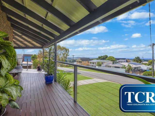CHARMING NORTH FACING TWO LEVEL HOME WITH OCEAN VIEWS
