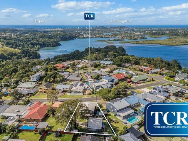 CHARMING NORTH FACING TWO LEVEL HOME WITH OCEAN VIEWS