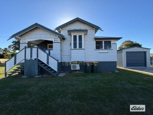 Charming Queenslander with Exceptional Shedding, Spacious Yard & Modern Comfort