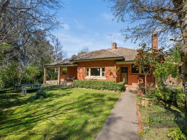 CHARMING RED BRICK IN A SOUGHT AFTER SETTING